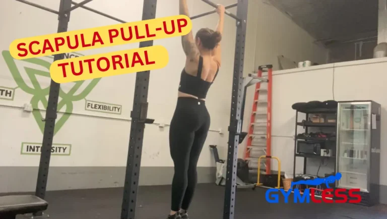 A woman demonstrating how to perform a scapula pull-up on a chin-up bar with the words "Scapula Pull-up Tutorial" visible in the foreground.